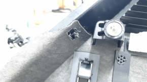 Right arch trim for a 1917-19 Lincoln MKC, black, with scuffs and scratches.