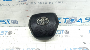 The driver's side airbag in the Toyota Camry V70 18-24 is black and has a rusty squib.