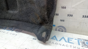 The rear engine guard of a Lincoln MKC 15-19 is worn, dented, and the fastener is torn.