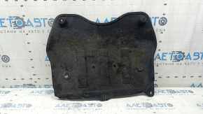 The rear engine guard of a Lincoln MKC 15-19 is worn, dented, and the fastener is torn.