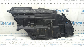 The left engine guard for a Toyota Avalon 13-15 is worn and dented.