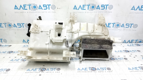 The bare heater housing of a Mitsubishi Outlander 14-16 without air ducts.