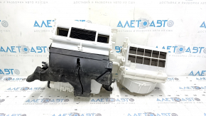 The bare heater housing of a Mitsubishi Outlander 14-16 without air ducts.