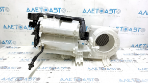 The bare heater housing of a Mitsubishi Outlander 14-16 without air ducts.