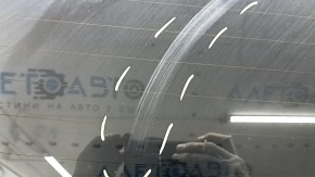 The trunk door is bare with glass, Volvo XC90 16-22 tinted, black 717, scratches on the glass.