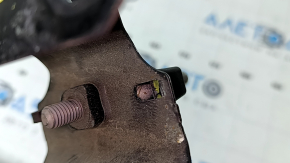 The left hood latch bracket of a Volvo XC90 16-25 is broken.