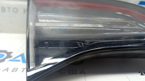 Tesla Model 3 18-Type 2 left inner trunk lid light, cracks, scratches