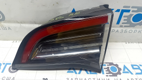 Tesla Model 3 18 right trunk lid interior light, type 2 scratches