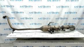 The exhaust pipe with the catalytic converter of the Toyota Prius 30 10-15 is rusty.