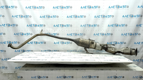 The exhaust pipe with the catalytic converter of the Toyota Prius 30 10-15 is rusty.