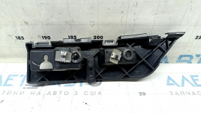 The left rear bumper mount under the headlight of a Ford Edge 19-24 has a broken guide.