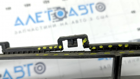 The lower grille of the front bumper of the Hyundai Ioniq 17-22 is gray, the fasteners are broken, there are scratches, and there are bumps.