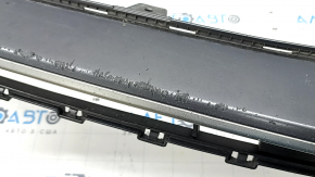 The lower grille of the front bumper of the Hyundai Ioniq 17-22 is gray, the fasteners are broken, there are scratches, and there are bumps.