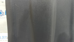 The rear driver's seat cover for a 2022 Hyundai Ioniq is black, with cracks in the fasteners and scratches.