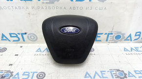 Black, scratched steering wheel airbag for the driver's side of a Ford Edge 19-24.