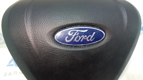 Black, scratched steering wheel airbag for the driver's side of a Ford Edge 19-24.