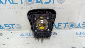 Black, scratched steering wheel airbag for the driver's side of a Ford Edge 19-24.