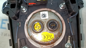 Black, scratched steering wheel airbag for the driver's side of a Ford Edge 19-24.