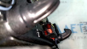 Black, scratched steering wheel airbag for the driver's side of a Ford Edge 19-24.