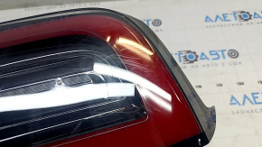 Tesla Model 3 18-USA right outer wing light, 3 pins, missing fragment, broken fasteners, cracks in glass, scuffed