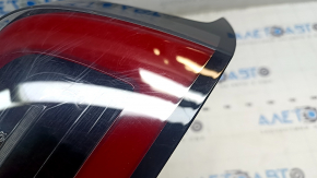 Tesla Model 3 18-USA right outer wing light, 3 pins, missing fragment, broken fasteners, cracks in glass, scuffed