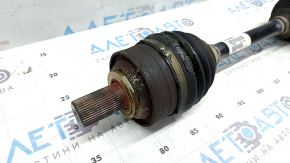 The front left half shaft of a Volvo XC90 16-23 T5, T6 AWD has a torn outer CV joint boot.