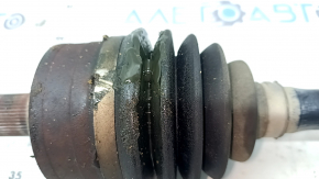 The front left half shaft of a Volvo XC90 16-23 T5, T6 AWD has a torn outer CV joint boot.