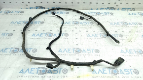 The wiring for the rear bumper of a Ford Edge 19-24 for parking sensors and a foot-operated trunk opening sensor has been cut.