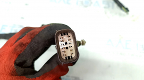 The wiring for the rear bumper of a Ford Edge 19-24 for parking sensors and a foot-operated trunk opening sensor has been cut.