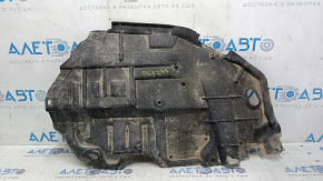 Right engine guard for Toyota Camry V50 12-14 USA is worn, torn, and dented.