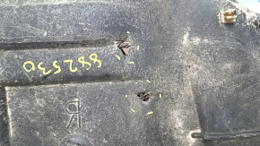 Right engine guard for Toyota Camry V50 12-14 USA is worn, torn, and dented.