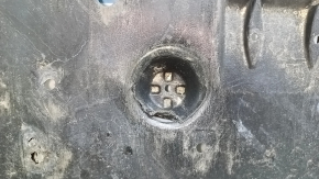 The front bumper guard for a Toyota Camry v70 18-24 is dented, torn, and worn.