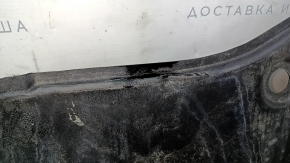 The front bumper guard for a Toyota Camry v70 18-24 is dented, torn, and worn.