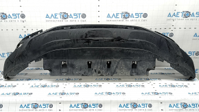 The front bumper lip of a VW Tiguan 22-24, structure, for parking sensors, is dented, has scratches, and has non-standard holes.