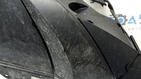 The front bumper lip of a VW Tiguan 22-24, structure, for parking sensors, is dented, has scratches, and has non-standard holes.