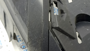 The front bumper lip of a VW Tiguan 22-24, structure, for parking sensors, is dented, has scratches, and has non-standard holes.