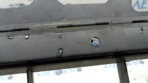 The front bumper lip of a VW Tiguan 22-24, structure, for parking sensors, is dented, has scratches, and has non-standard holes.