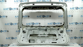 The trunk door is bare, VW Tiguan 18-24, white LC9A, dents, sooty