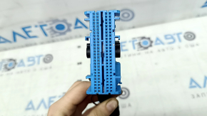 A large chip for the SRS airbag module and airbag computer on a BMW X1 F48 16-22.