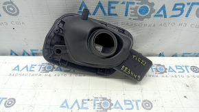 The fuel filler flap housing of a VW Tiguan 18-24 has broken fasteners, a torn seal, and a crack in the housing.