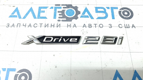 Emblem inscription "X Drive 28i" on the trunk door of the BMW X1 F48 19-22