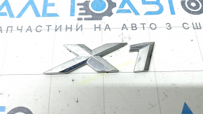 Emblem with the inscription "X1" on the trunk door of the BMW X1 F48 19-22