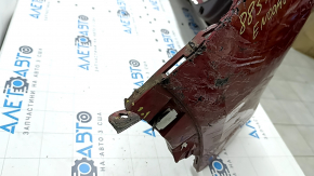 The bare rear bumper of a Buick Encore 17-22 without BSM, without reflector brackets, is dented, torn, has broken fasteners and scratches.