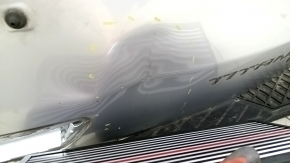 The tailgate is bare, dented, and has dents, for a 19-24 Ford Edge UX silver.