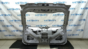 The tailgate is bare, dented, and has dents, for a 19-24 Ford Edge UX silver.