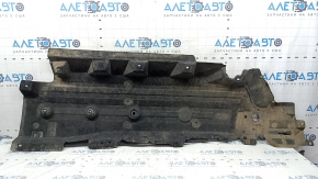 The right underbody protection of a Ford Edge 15-24 is worn and torn.
