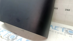 Volvo XC60 18-25 black rear lower center console trim, under the cigarette lighter, scratches