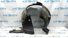 The front right fender liner of a 17-22 Buick Encore is dented and has tears.
