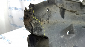 The front right fender liner of a 17-22 Buick Encore is dented and has tears.
