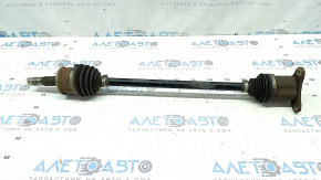 The rear right axle shaft of a Buick Encore 13-22 is rusty.